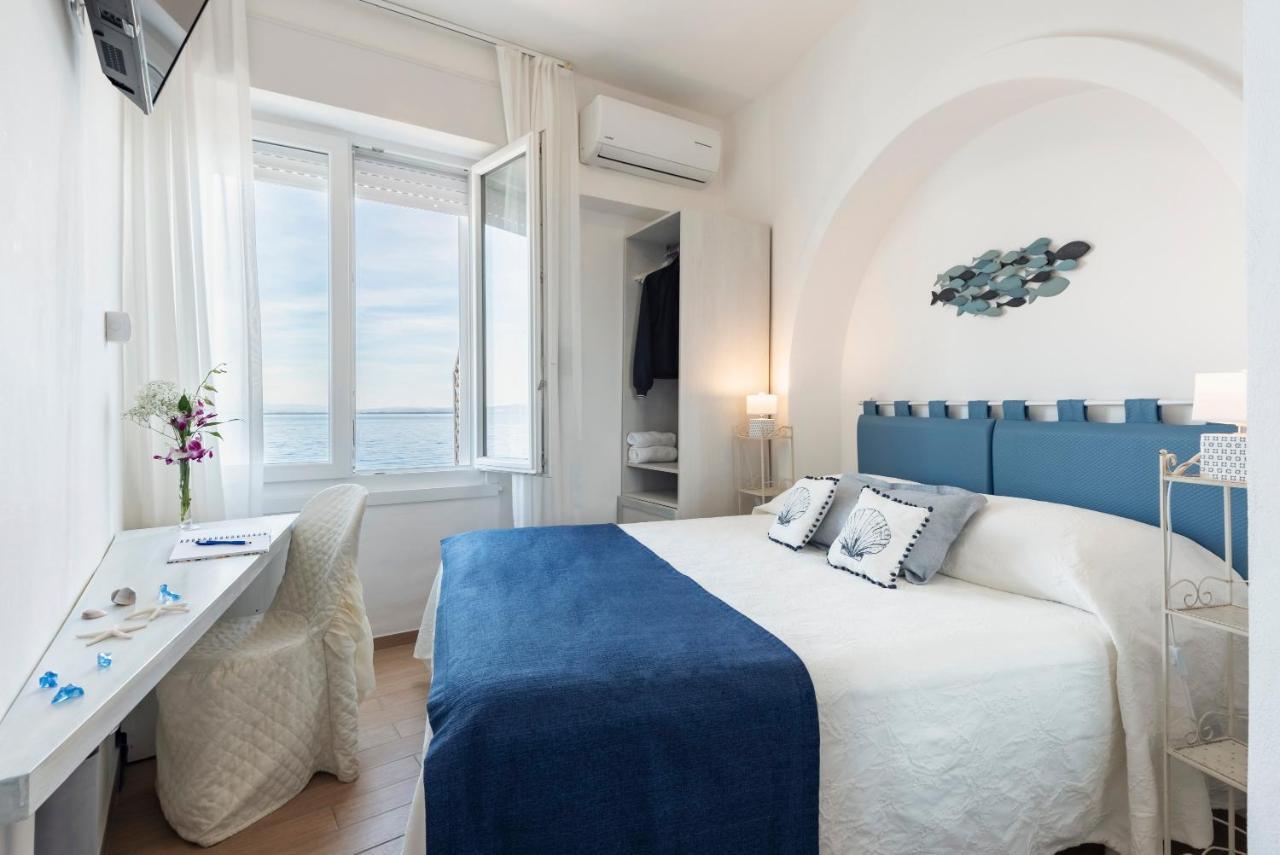 Hotel La Caletta Порто Санто Стефано Екстериор снимка