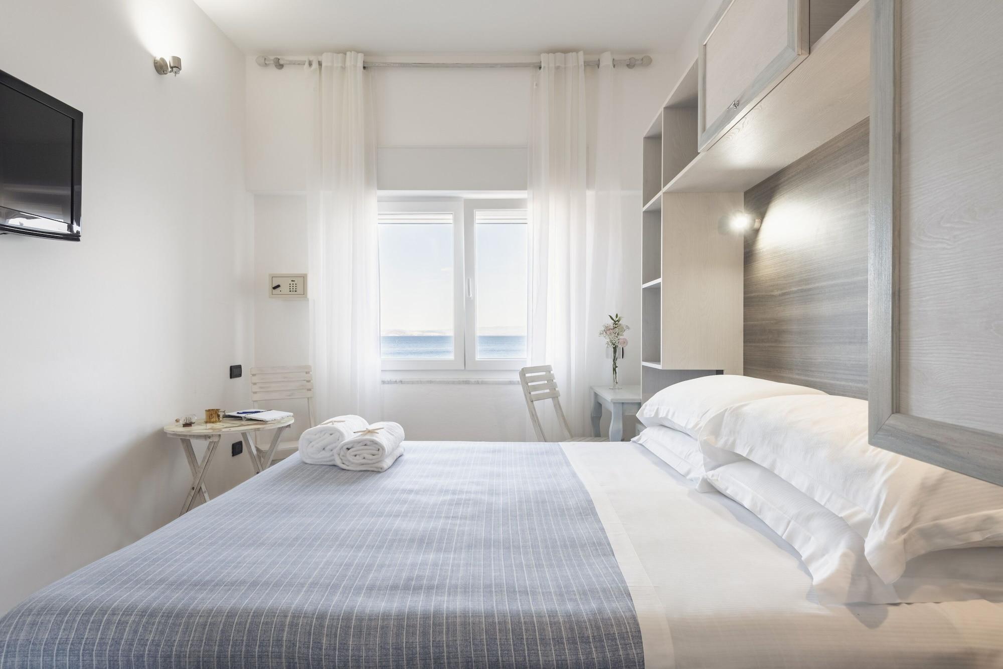 Hotel La Caletta Порто Санто Стефано Екстериор снимка