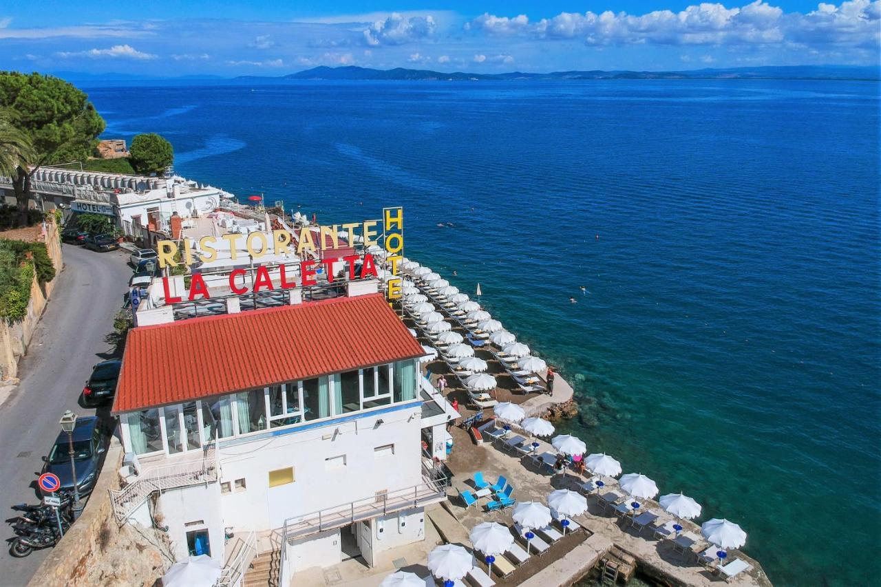 Hotel La Caletta Порто Санто Стефано Екстериор снимка